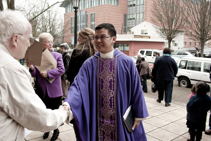 Greeting parishioners after Mass.